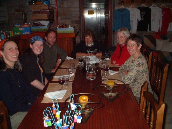 Dinner at Albergue do Brasil. Cristina sits at the head of the table.