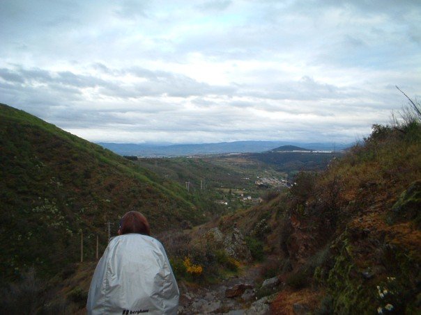 The rocky path down and west