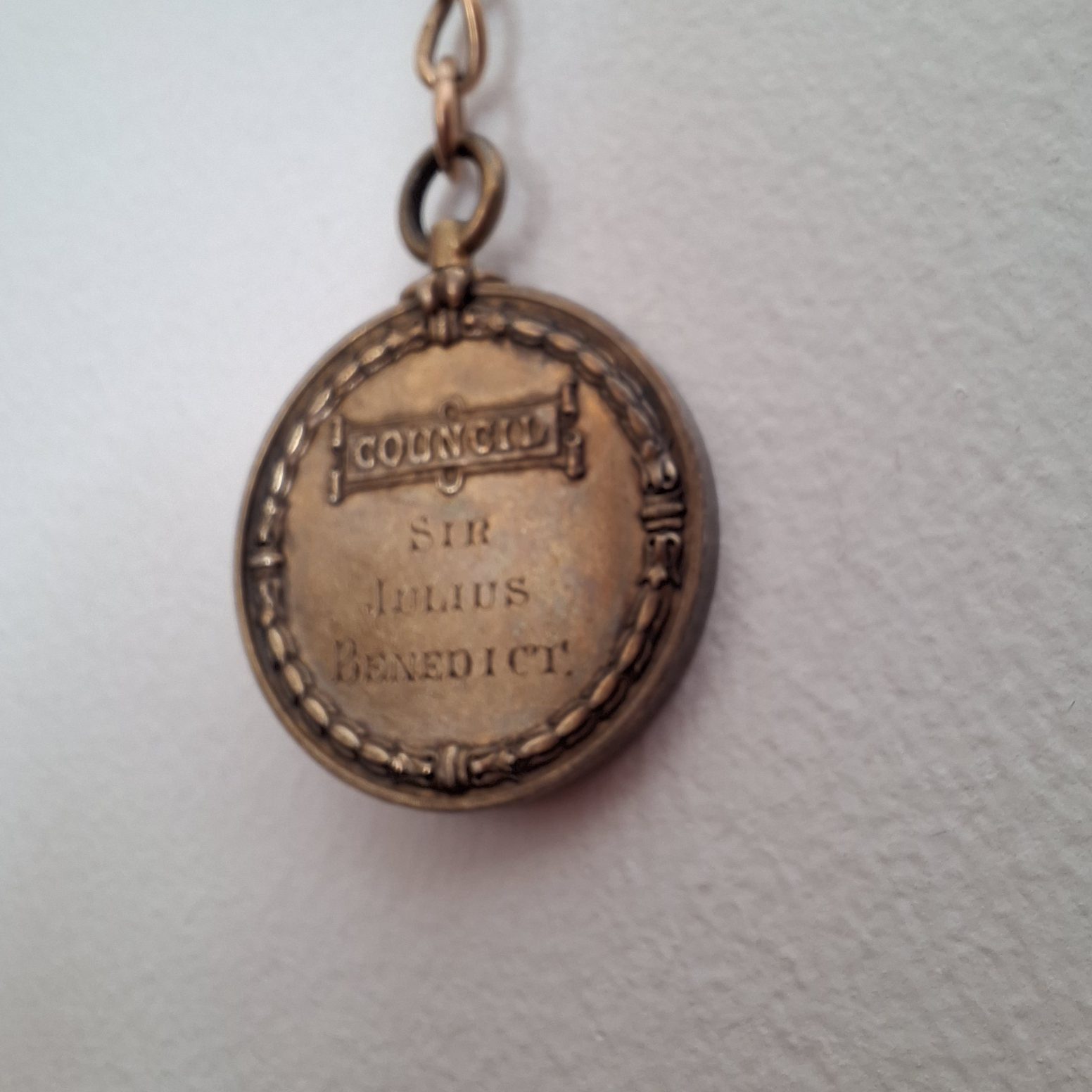 Bronze-coloured medal with text "Council", "Sir Julius Benedict"